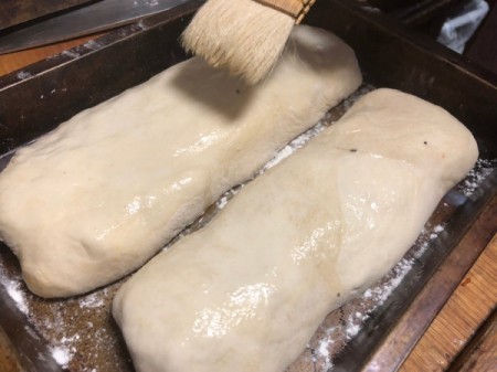 brushing Stromboli with egg wash