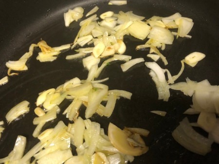cooking cut onions in pan