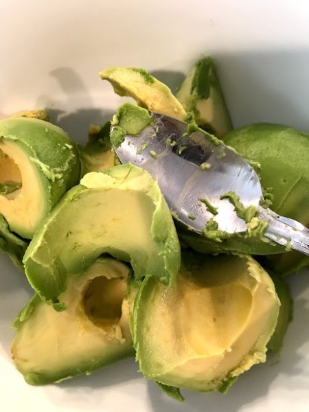 peeled pitted avocado