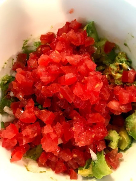 chopped tomatoes and other ingredients in bowl