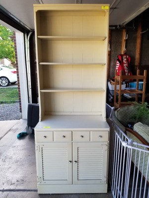 Dating Ethan Allen Furniture - white shelf unit with drawers and door at the bottom