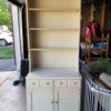 Dating Ethan Allen Furniture - white shelf unit with drawers and door at the bottom