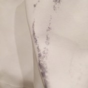 Removing Dye Transfer from Faux Leather Coat - black dye on white coat