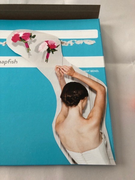 Making a Collage Folder - begin gluing clippings down