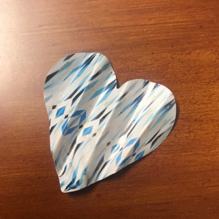 Making Confetti from Magazines and Shopping Catalogs - folded heart to use as gift packing