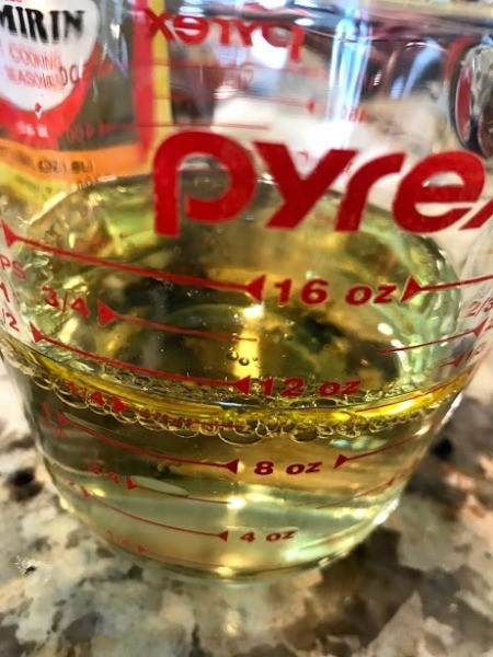 mixing marinade in measuring cup