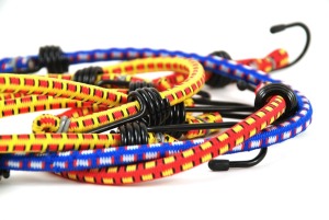 Colorful bungee cords on white background