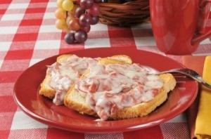 Chipped Beef on toast on a red plate