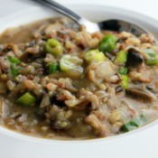 Mushroom and Wild
Rice Soup in a white bowl with a spoon
