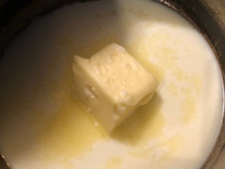 melting butter and milk in pan