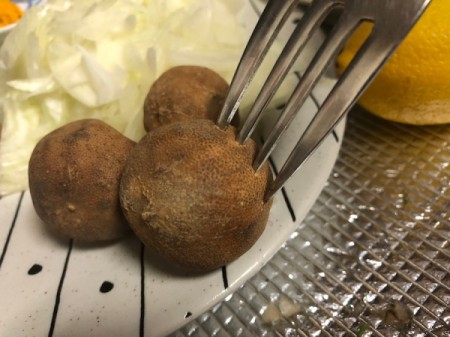 piercing dried limes with fork