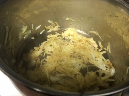 sautéing onions in pan