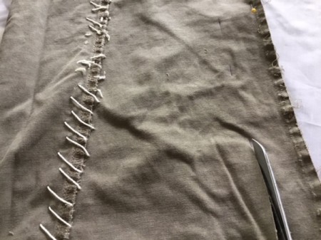 How to Turn Pants Into Shorts and a Bag - cut the one inch strip lengthwise on both legs