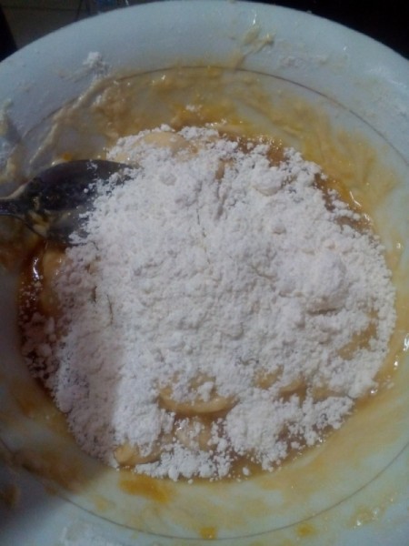 adding flour to dough