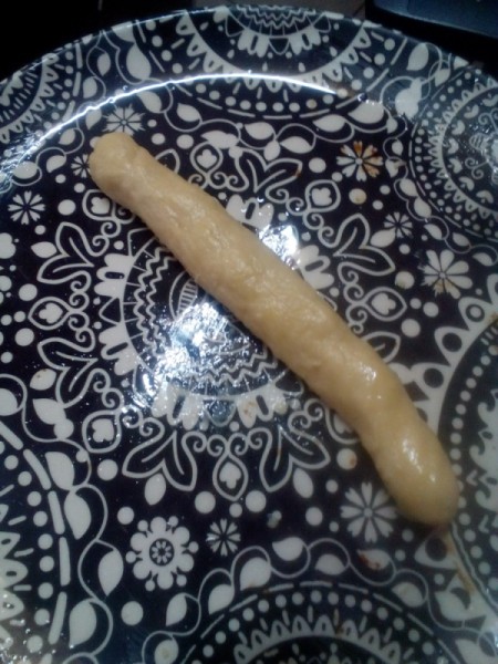 rolled dough piece on plate