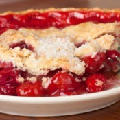 Close up of a slice of cherry pie.
