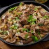 Chicken and mushrooms in a cast iron skillet