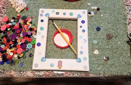New Baby Frame - glue button on and then cover with homemade decoupage