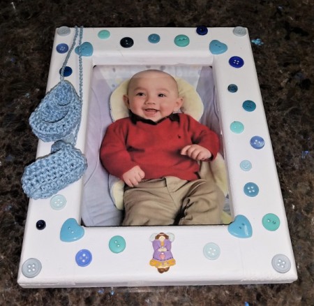 New Baby Frame - booties tacked to the frame