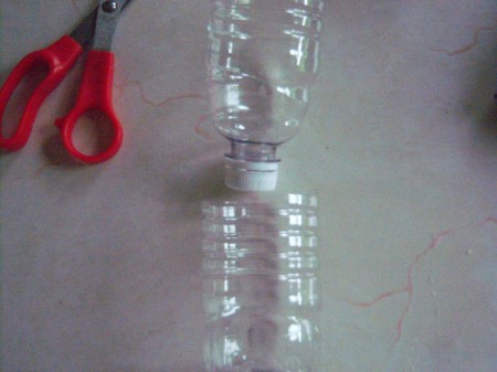 How to Make a Recycled Water  Bottle Planter - invert bottle in fit into the bottom half
