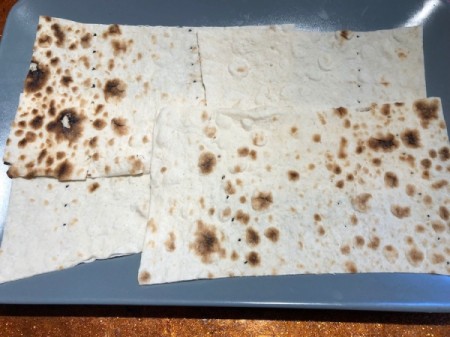 spread lavash bread on tray
