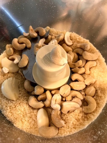 Cashews, garlic and cheese in food processor