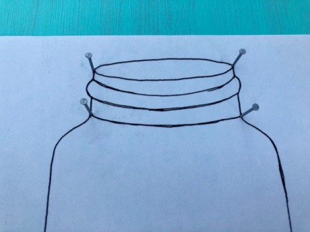 Yarn and Nail Wall-Hanging Vase - hammer nails in about halfway around the template lines
