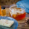 Honey Hair Treatment with towels and soap on a wood table