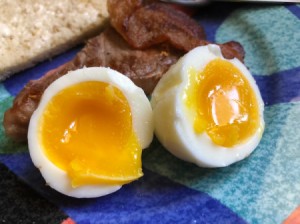 A softboiled egg cut into half.