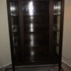 Value of an Antique China Cabinet - dark wood, glass fronted cabinet