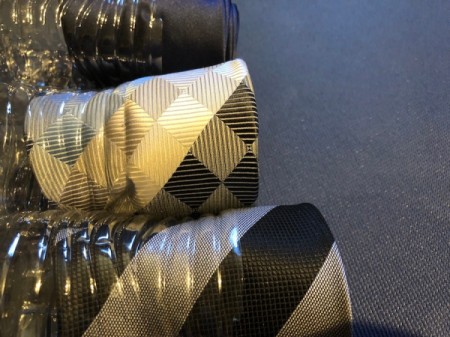 Floating Necktie Organizer - stuff half way into the bottles