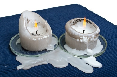 Melted candle wax on rug.