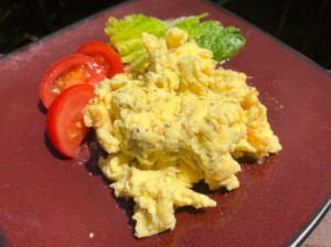 Scrambled Eggs on plate with lettuce and tomato