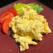 Scrambled Eggs on plate with lettuce and tomato