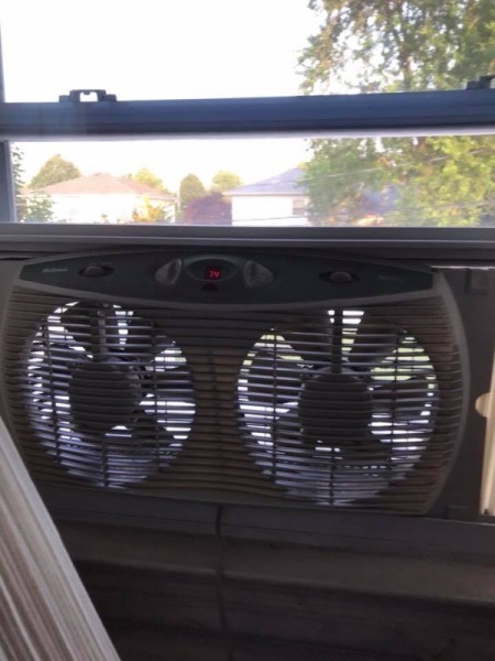 A box fan in a window.