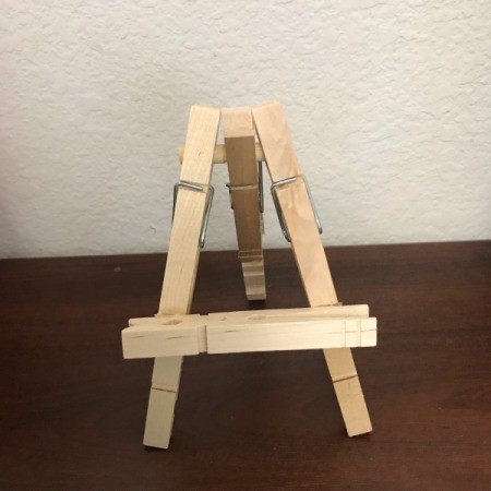 Mini Wooden Clothespin Easel - twist the center pin down and back to allow easel to stand