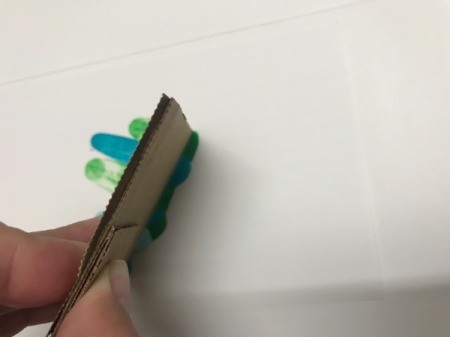 Abstract Acrylic Painting -spread with a piece of cardboard