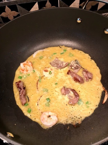 Crepe cooking in pan