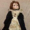 Identifying a Porcelain Doll - doll with a long coat