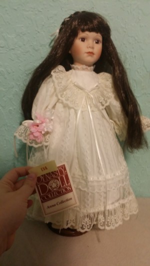 Information and Value of a Dynasty Porcelain Doll - dark haired doll in white long dress