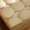 Dough balls on a tray.