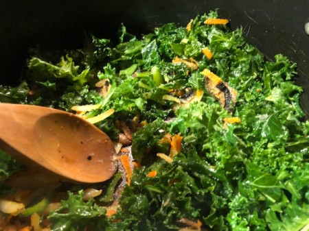 mixing vegetables in pan