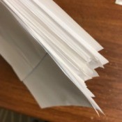 A stack of scraps of paper to be used for notes.