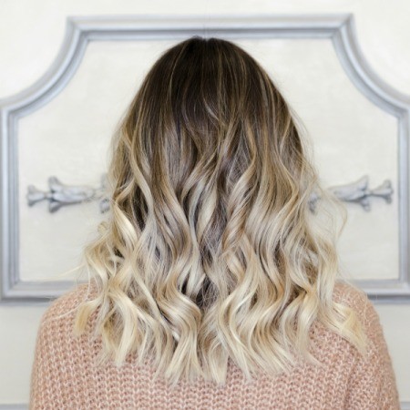 Blond with a Balayage hair dye job.