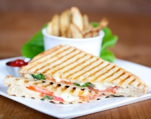 Panini grilled sandwich on a plate.