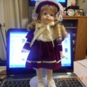 Value of a Porcelain Doll - doll on stand