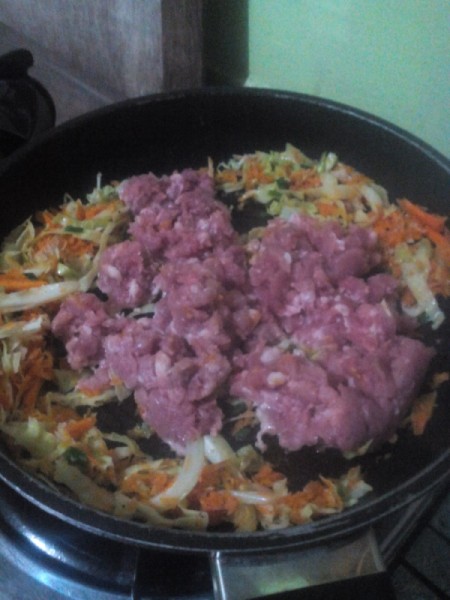 ground meat added to pan