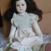 Identifying a Porcelain Doll - doll sitting in front of a box
