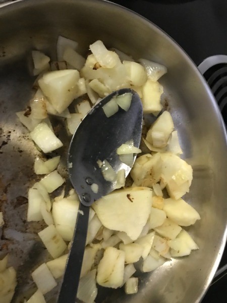 Sautéing onions and in pan Potatoes