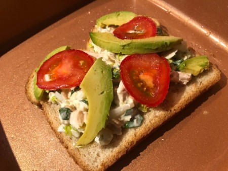 tomato and avocado added to bread